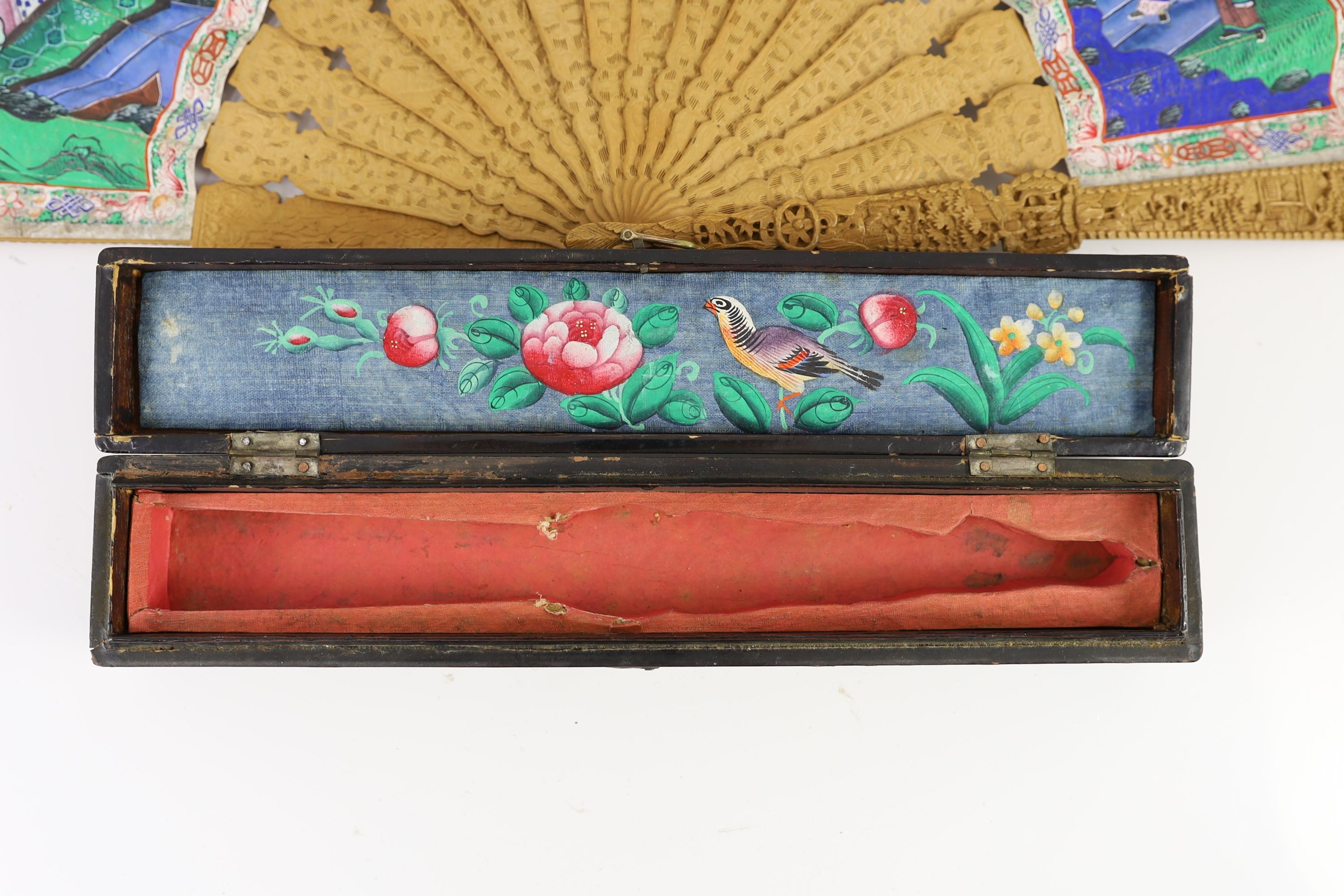 A Chinese lacquer cased sandalwood and lacquer fan, 19th century, 32cm, slight damage